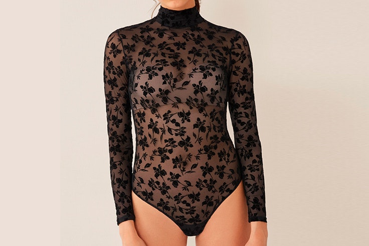 Body negro de tul con flores de manga larga y cuello cisne de Women Secret