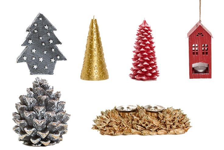 Vela árbol de Navidad con estrellas (9,99€)/Vela árbol con estrella dorada (12,99€)/Vela en forma de abeto rojo (15,99€)/Portavela casita (7,99€)/Vela en forma de piña con purpurina (7,99€)/Centro de mesa con portavela (15,99€)